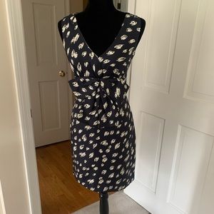 Classic Kate Spade silk dress in navy and white print and signature bow.